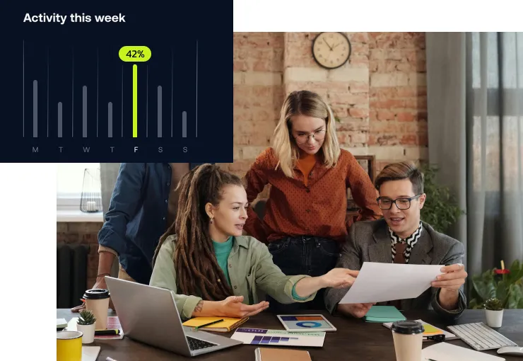 An activity chart laid over a team comparing printed results at a desk